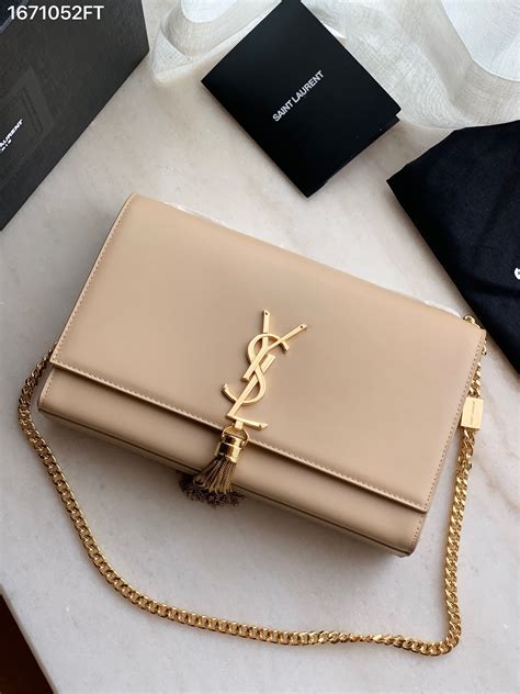 ysl monogram tassel clutch|ysl monogram clutch beige.